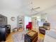 Inviting living room featuring vaulted ceiling and hardwood floors at 26338 Glen Eagle, Leesburg, FL 34748
