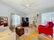 Bright living room showcases hardwood floors and comfortable seating arrangement at 26338 Glen Eagle, Leesburg, FL 34748