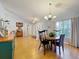 Open concept living space with dining area and sitting area with wood-look flooring at 26338 Glen Eagle, Leesburg, FL 34748