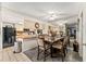 Bright kitchen open to the dining area featuring a stylish table setting with a bar-style countertop seating area at 2920 Poplar Ave, Leesburg, FL 34748