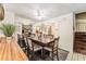 Comfortable dining area with a wooden table, seating for six, and plenty of natural light at 2920 Poplar Ave, Leesburg, FL 34748