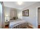 Bedroom with hardwood floors, neutral walls and a comfortable bed at 30523 Orange Dr, Leesburg, FL 34748