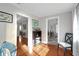 Open hallway showcasing hardwood floors and seamless transitions to other rooms of the home at 30523 Orange Dr, Leesburg, FL 34748