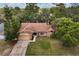 Aerial view of the home on a large lot surrounded by mature trees, showcasing its serene setting at 3184 Maltby Dr, Deltona, FL 32738