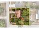 Aerial view of a charming home with a well-maintained lawn and mature trees on a spacious lot at 3184 Maltby Dr, Deltona, FL 32738