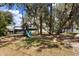 This backyard has a swing set with a slide, perfect for entertaining , and plenty of trees for shade at 3184 Maltby Dr, Deltona, FL 32738