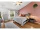 Serene bedroom with accent wall and plush bedding at 3184 Maltby Dr, Deltona, FL 32738