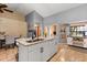 Spacious kitchen island with sink and breakfast bar offering granite countertops and seating at 3184 Maltby Dr, Deltona, FL 32738