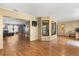 Open-concept living area with hardwood floors, a picture window, and bright light at 3184 Maltby Dr, Deltona, FL 32738