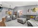 Inviting living room with gray walls, comfortable seating, and hardwood flooring, creating a cozy atmosphere at 3184 Maltby Dr, Deltona, FL 32738