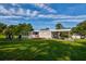 Expansive backyard with lush green grass, trampoline, and plenty of space at 3359 County Road 513, Wildwood, FL 34785