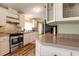 Well-lit kitchen with modern appliances, countertops, and stylish backsplash at 3359 County Road 513, Wildwood, FL 34785