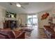 Comfortable living room with a fireplace and sliding glass doors to the patio at 3359 County Road 513, Wildwood, FL 34785