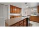 The kitchen has lots of countertop space with wooden cabinets and stainless steel appliances for modern convenience at 37007 Forestdel Dr, Eustis, FL 32736