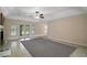 Large living room with tile flooring, ceiling fan, and french doors at 37007 Forestdel Dr, Eustis, FL 32736