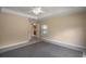The main bedroom boasts tray ceilings, natural light, and comfortable carpeting for a serene retreat at 37007 Forestdel Dr, Eustis, FL 32736
