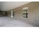 Spacious covered outdoor patio area with access to the yard, offering a serene space for relaxation at 37007 Forestdel Dr, Eustis, FL 32736