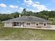 Charming home featuring a spacious backyard, screened porch and classic architecture at 37007 Forestdel Dr, Eustis, FL 32736