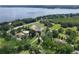 Desirable neighborhood with lush landscaping and lake views. The property features mature trees at 37138 Lake Yale Pl, Grand Island, FL 32735