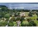 Expansive lot with beautiful lake views, mature trees, and red outline of property at 37138 Lake Yale Pl, Grand Island, FL 32735