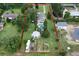 Aerial view showing the large lot with home, outbuildings, garden, and defined property lines at 37138 Lake Yale Pl, Grand Island, FL 32735