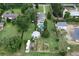 Aerial view of the entire property showing home, pool, outbuildings and extensive lot at 37138 Lake Yale Pl, Grand Island, FL 32735