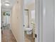 Bright bathroom with a neutral palette, shower and white blinds at 37138 Lake Yale Pl, Grand Island, FL 32735