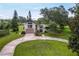 Beautiful two-story home with circular driveway and professionally landscaped grounds at 37138 Lake Yale Pl, Grand Island, FL 32735