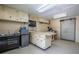 Spacious garage with built-in cabinets, shelving, and ample workspace at 37138 Lake Yale Pl, Grand Island, FL 32735