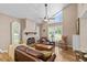 Inviting living room features hardwood flooring, fireplace and lots of natural light at 37138 Lake Yale Pl, Grand Island, FL 32735