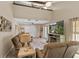 Living room with high ceilings and a spiral staircase to the loft at 37138 Lake Yale Pl, Grand Island, FL 32735