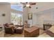 Inviting living room features hardwood flooring and lots of natural light at 37138 Lake Yale Pl, Grand Island, FL 32735