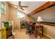 Bright home office space with beamed ceiling, ceiling fan, desk, and ample storage at 37138 Lake Yale Pl, Grand Island, FL 32735