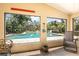 The screened-in lanai features a sparkling pool and multiple places to relax at 37138 Lake Yale Pl, Grand Island, FL 32735