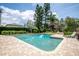 Inviting pool area with lush landscaping, gazebo, and ample lounging space at 37138 Lake Yale Pl, Grand Island, FL 32735