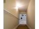 View of a staircase leading down to a finished basement area with shelving at 37138 Lake Yale Pl, Grand Island, FL 32735