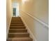 Carpeted stairs lead up to the second floor at 37138 Lake Yale Pl, Grand Island, FL 32735