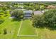 Sprawling property featuring a home with a screened pool and large fenced backyard at 4445 Blue Major Dr, Windermere, FL 34786