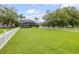 A serene view of the expansive fenced backyard, perfect for outdoor activities and relaxation at 4445 Blue Major Dr, Windermere, FL 34786