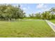 Lush backyard featuring a white picket fence, perfect for pets or outdoor enjoyment at 4445 Blue Major Dr, Windermere, FL 34786
