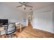 Bedroom with hardwood floors, neutral paint, and ceiling fan at 4445 Blue Major Dr, Windermere, FL 34786