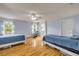 Large bedroom with wood floors, two beds, and lots of natural light at 4445 Blue Major Dr, Windermere, FL 34786
