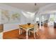 Bright dining area next to the living room with hardwood flooring and staircase at 4445 Blue Major Dr, Windermere, FL 34786