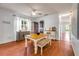 Dining room featuring a wooden table, bench seating, and a decorative buffet at 4445 Blue Major Dr, Windermere, FL 34786