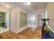 Hallway featuring wood floors and stairs leading to the second floor at 4445 Blue Major Dr, Windermere, FL 34786