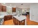 Open kitchen layout leading to the living room with a view of the pool at 4445 Blue Major Dr, Windermere, FL 34786
