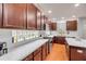 Open kitchen with stainless steel appliances and sleek white countertops at 4445 Blue Major Dr, Windermere, FL 34786