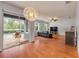 Bright living room with wood floors, and sliding glass doors to a pool at 4445 Blue Major Dr, Windermere, FL 34786