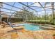 Relaxing screened-in pool with a spa and lounge chairs, perfect for enjoying the outdoors at 4445 Blue Major Dr, Windermere, FL 34786