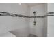Modern shower featuring elegant white tile and sleek, contemporary fixtures and accents at 4445 Blue Major Dr, Windermere, FL 34786